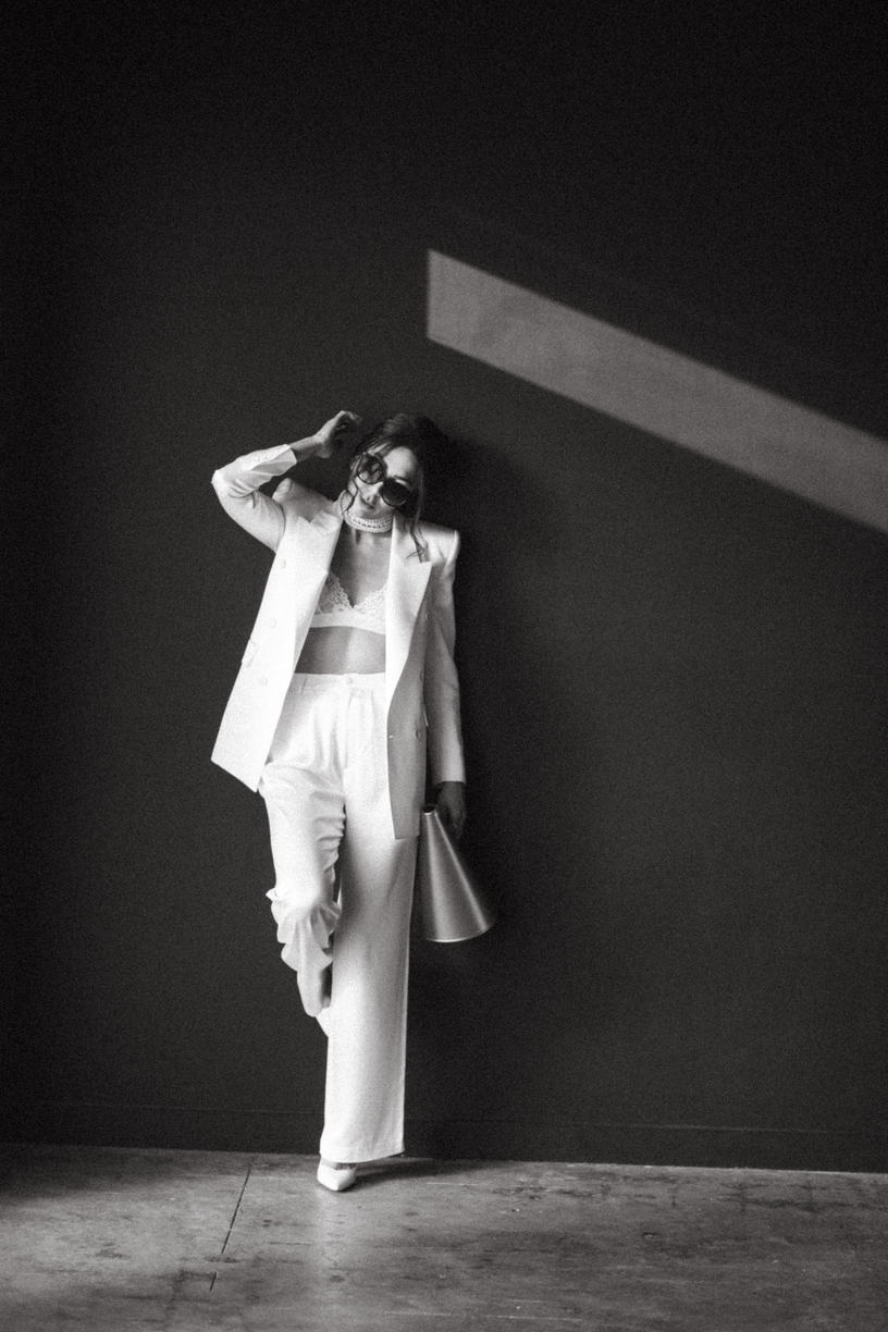 Christina in white suit